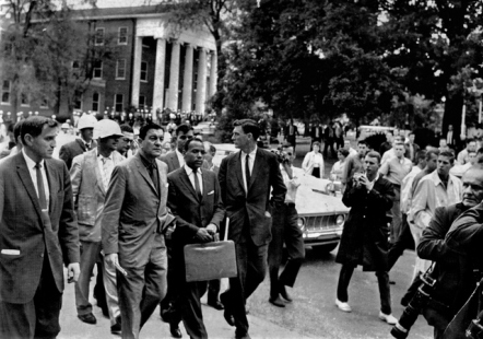 While registering for classes James Meredith is met by a passionately angry crowd in front of Ole Miss' famed Lyceum.